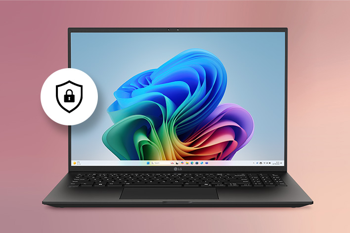This image shows a laptop displaying a colorful Windows wallpaper with a security shield icon beside it, highlighting the device’s built-in hardware-based protection features.