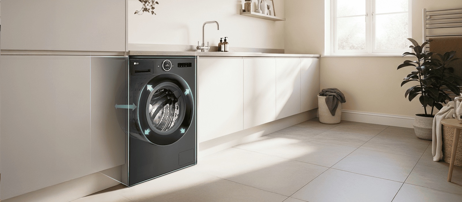 غسالة مدمجة أمامية التحميل في مطبخ ساطع مع أسهم تُبرز حجم الأسطوانة والسعة الواسعة.