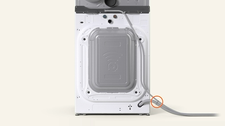 Rear view of LG WashTower™ showing two drain hoses tied together and connected securely