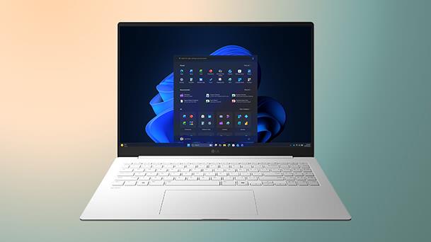 This image shows a laptop displaying a clear Windows 11 screen on a gradient background with a copy of "Upgrade your Efficiency."