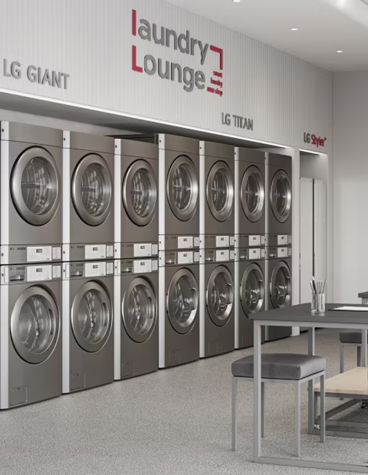 Side view of stacked LG Giant and LG Titan commercial laundry machines in premium laundromat space