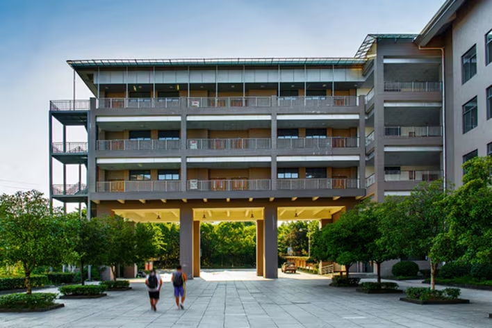Dormitory-style building commonly equipped with shared commercial laundry facilities	