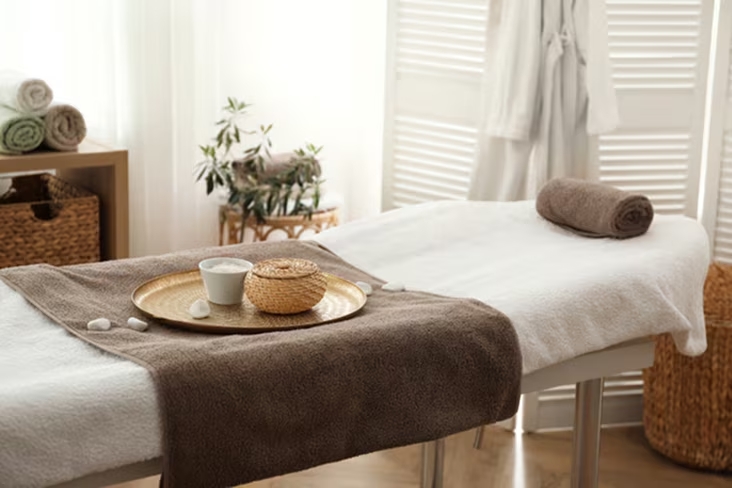 Spa treatment room with clean towels and calm interior, representing premium laundry quality	