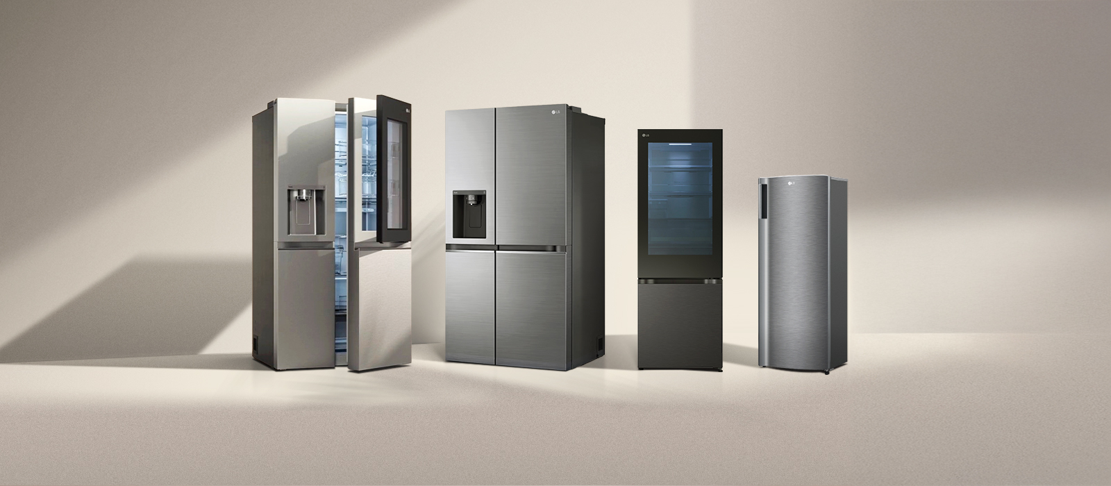 Four LG refrigerator freezers in the sun. Left multi-door refrigerator with side-by-side and two-door one-door models next to it.