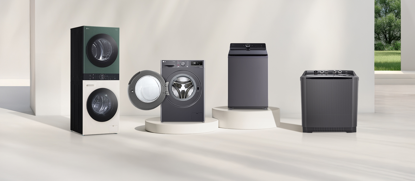 In front of the beige wall, there is the LG Wash Tower front loading washer, top loading washer, and twin washing machine lineup. On the right, you can see the forest view.