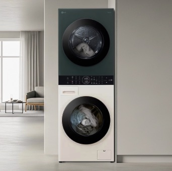 LG WashTower with green and beige two-tone design, neatly installed inside a built-in wardrobe. Surrounding it are organised clothes, baskets, and household items.