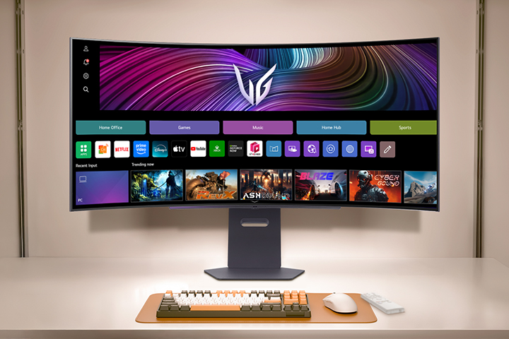 A curved LG UltraGear monitor displays a smart interface with app icons for streaming, gaming, music, and productivity, alongside a content row featuring popular games and entertainment options.