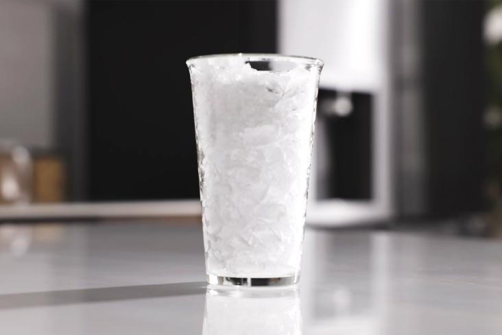 Glass filled with crushed ice made in an LG refrigerator