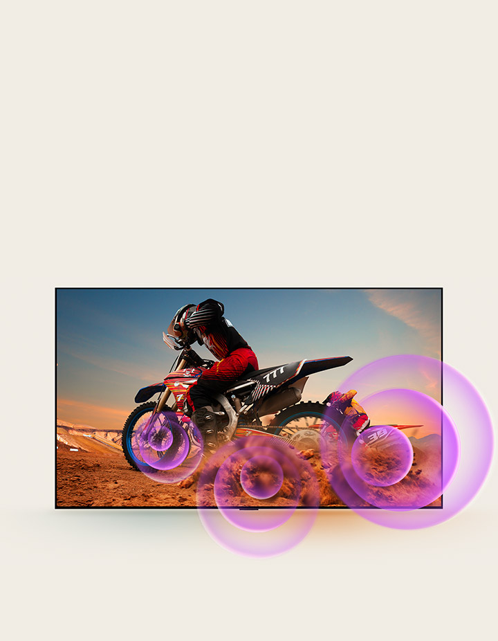 LG NanoCell TV depicts a man on a motorcycle with purple abstract circles coming out of the wheel to visualize sound emission.