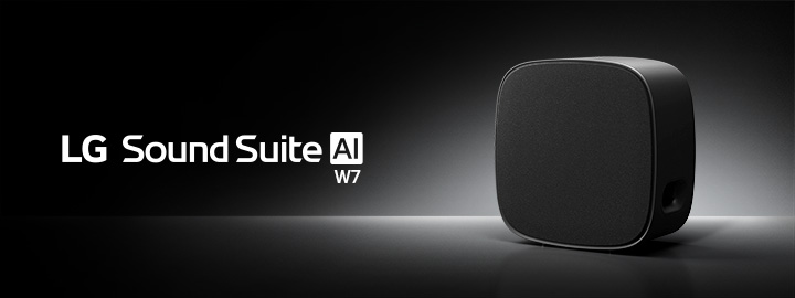 LG Sound Suite W7 woofer with a refined black finish, placed on a black surface for premium surround sound systems