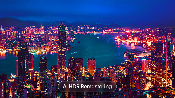 LG Micro RGB evo AI MRGB95 with AI HDR Remastering is shown in a split cityscape comparison, with SDR on the left and AI HDR Remastering on the right, displaying brighter city lights, deeper contrast, and more vivid detail across the scene.