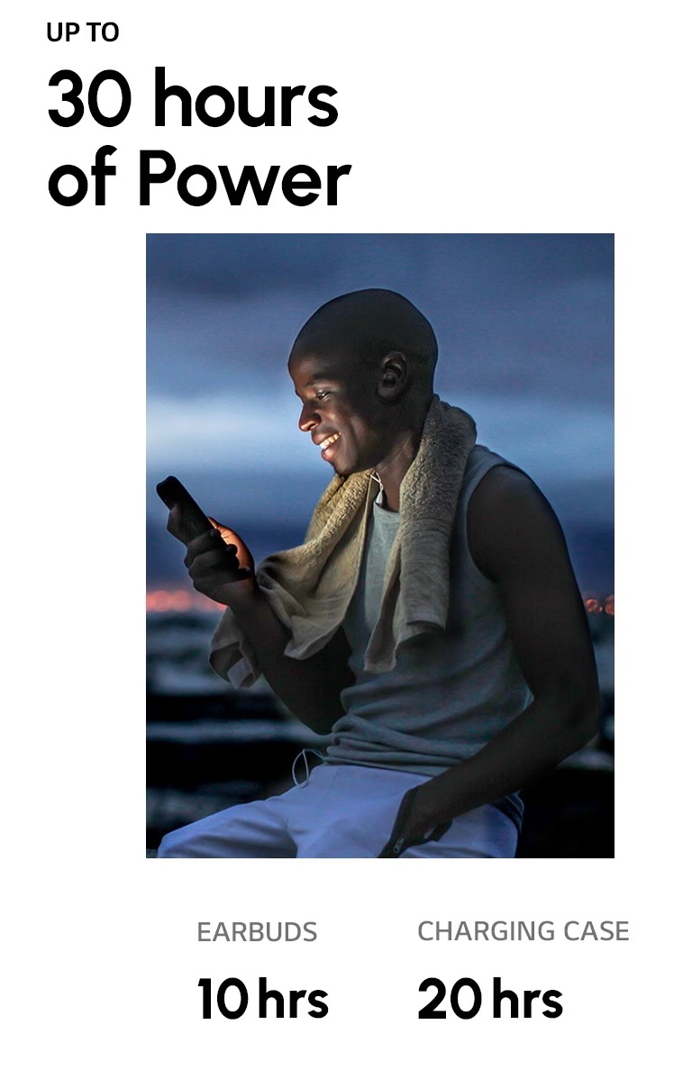 A man wearing the TONE Free fit and looking at his smartphone. The sky is dark as he just finished his evening workout. A woman wearing TONE Free fit earbuds is catching her breath in sunny weather.