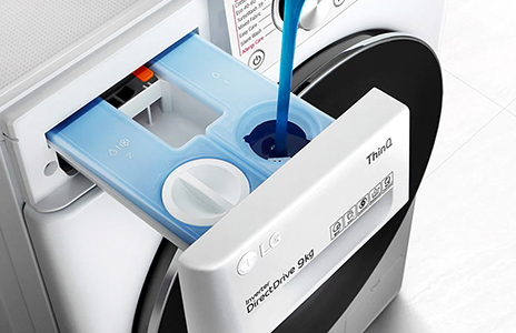 This is an image of filling the auto dosing detergent dispenser of the washing machine.