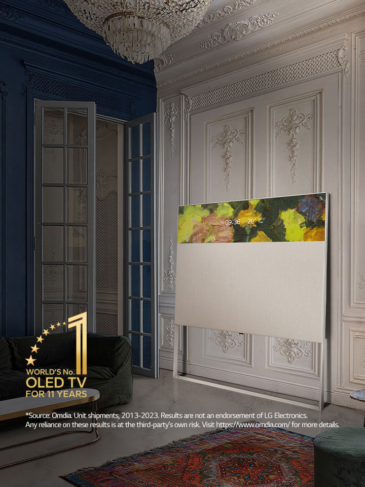 EASEL in Line View leaning against a wall with decorative molding. It sits next to a painting on the wall and behind an intricately designed rug. 10 Year World's No.1 OLED TV emblem.