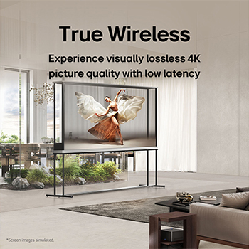 LG Signature OLED T sits in the middle of a modern living room depicting a dancer. Zero Connect Box is placed on a small table next to the couch.