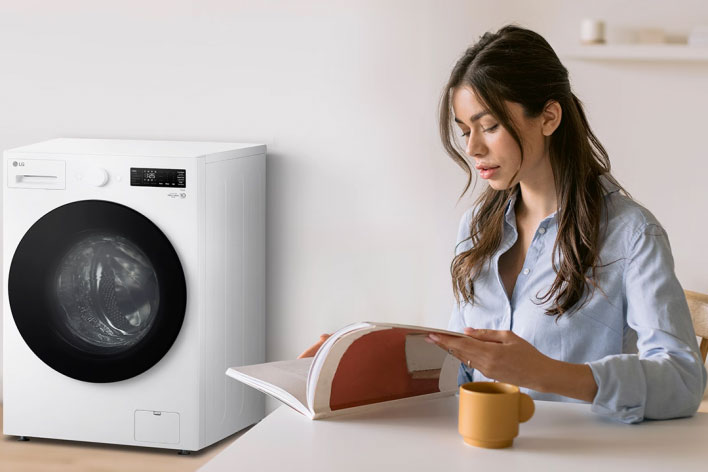 Close-up of a black LG top-load washing machine drum with a TrueBalance Anti-Vibration system icon.