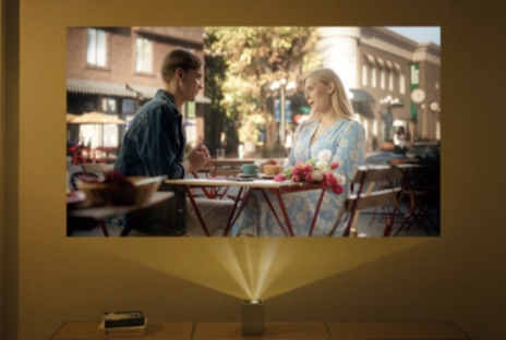 Video of two people talking projected by LG CineBeam