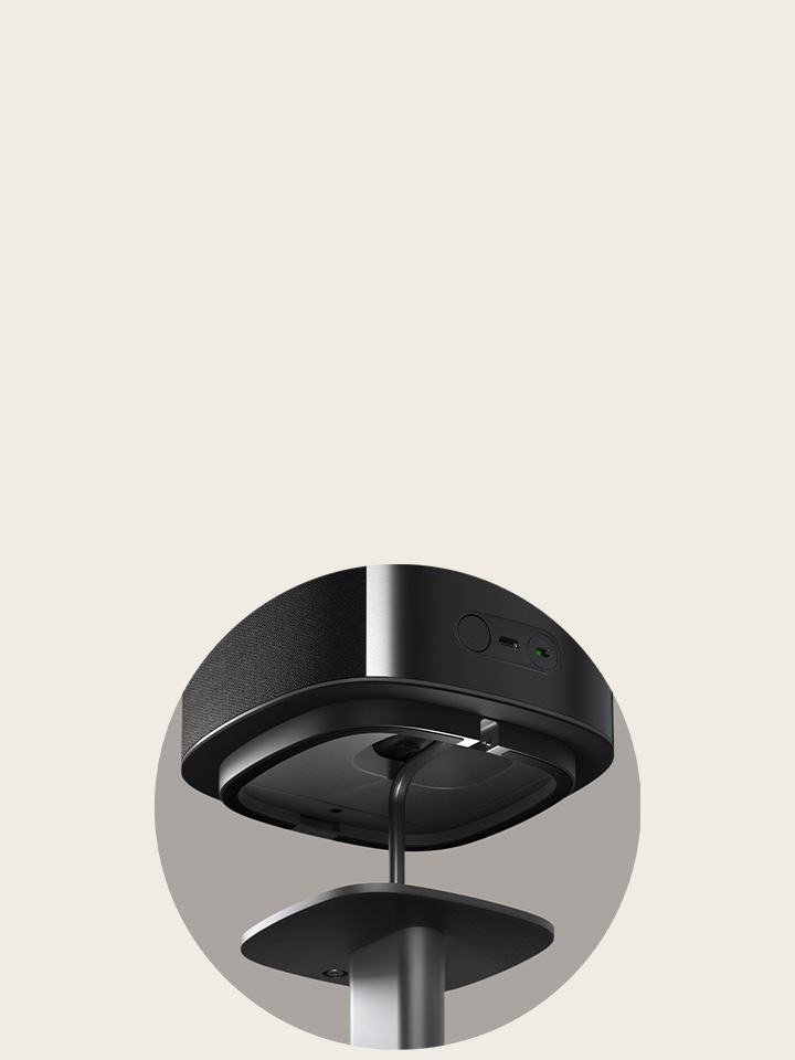 'Bottom view of an LG Sound Suite wireless speaker highlighting the sturdy base and stand connection