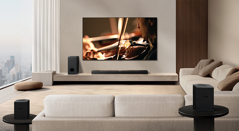 LG TV, LG Soundbar, a subwoofer and rear speakers are in a modern city apartment. The background gets dimmed, and the grid overlay appears over the image from LG TV, like a scan of the space. A dotted line extends from one of the rear speaker, to show the two rear speakers are in a linear fashion. White beads of sound come together to make waves, filling the room with sound.