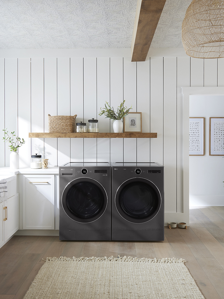 This is an image of a washing machine placed in a laundry room.