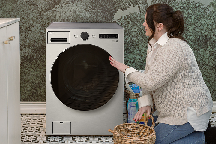 The video shows the woman putting laundry into the washing machine, the woman operating the washing machine, and the washing machine button.