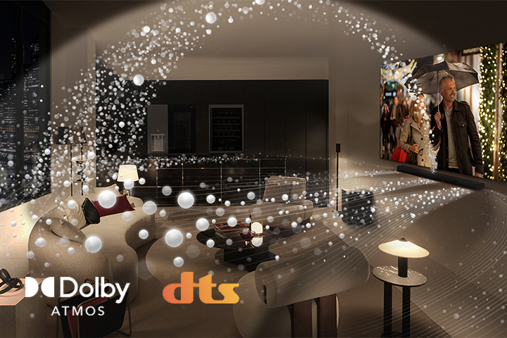 A movie plays on an LG OLED TV and LG Soundbar in a modern city apartment in a side angle view. White beads depicting sound waves project upwards and downwards from the Soundbar and TV, creating a dome of sound in the space.  Dolby Atmos logo DTS logo