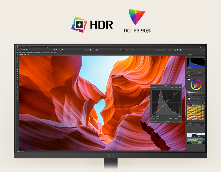 Vue avant d’un moniteur LG blanc affichant une image éclatante d’un canyon avec des outils de correction des couleurs, mettant en valeur la compatibilité HDR et la couverture colorimétrique DCI-P3 à 90 %.