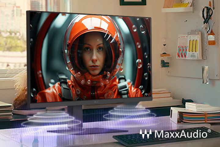 Un poste de travail équipé d’un moniteur LG affichant une femme en combinaison spatiale, sublimé par les effets visuels MaxxAudio qui suggèrent la projection sonore des haut-parleurs intégrés.