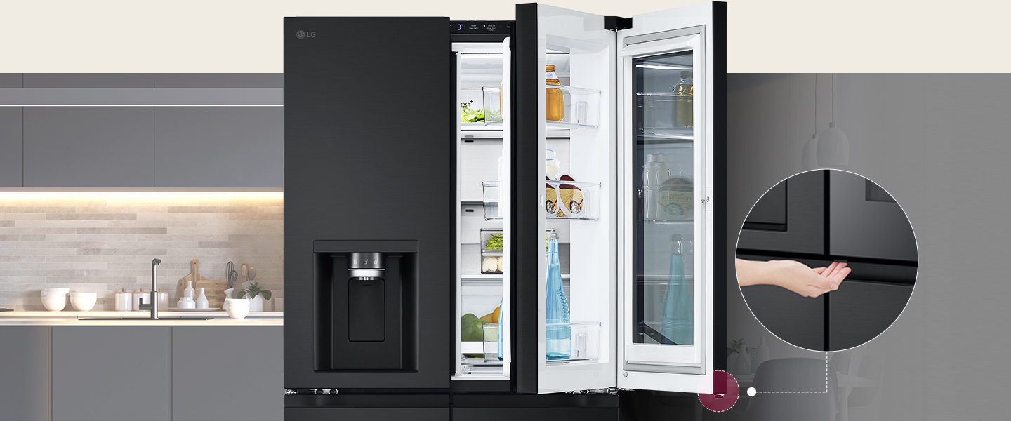 Sleek black LG refrigerator with door-in-door feature, open in modern kitchen showing organized shelves.