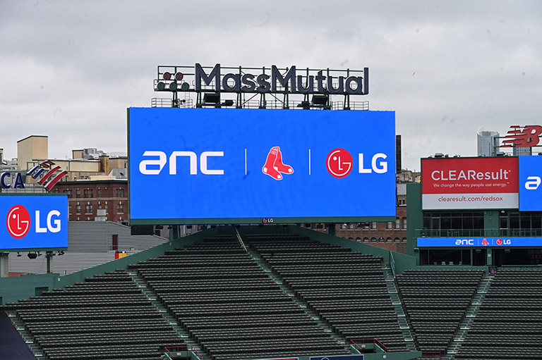 The main LED signage at Fenway Park displays the partnership between ANC, the Boston Red Sox, and LG.