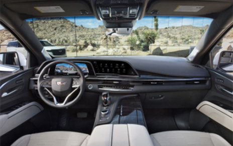 An image showing the front interior design of a Cadillac with LG’s infotainment system on show
