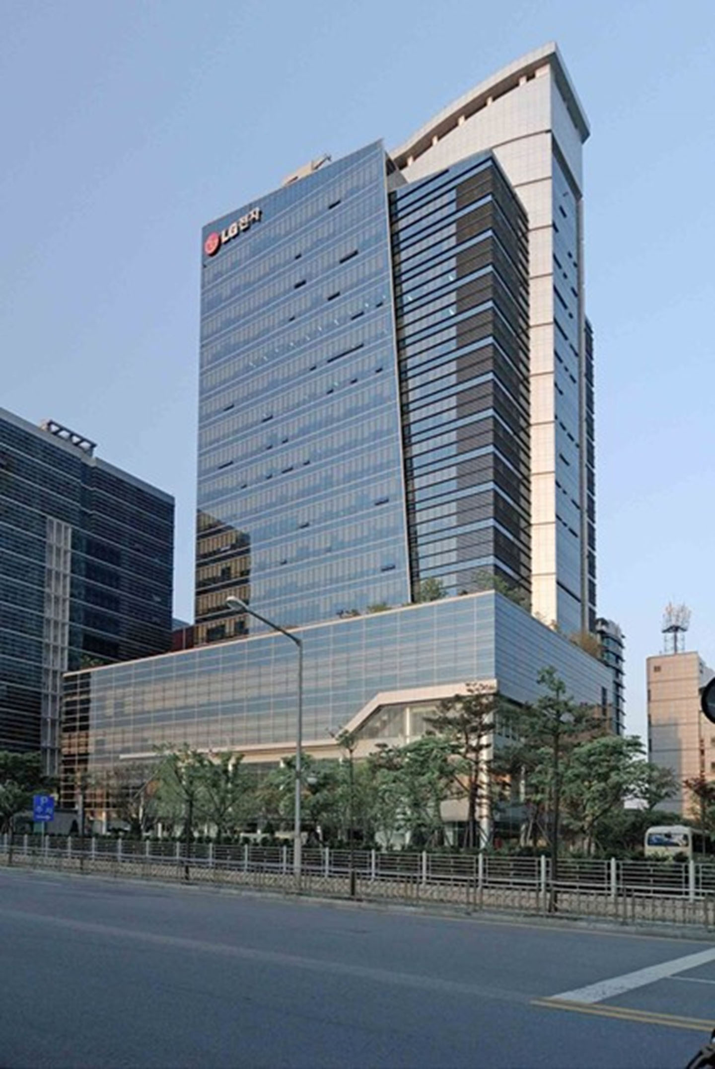 An exterior view of the relocated lab in the Guro Industrial Complex features the LG logo at the top of the high-rise office tower.