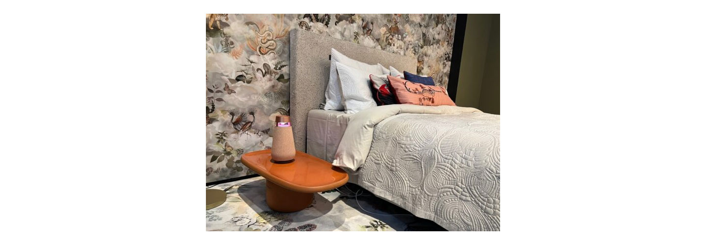 The LG XBOOM 360 speaker pictured next to a bed at LG's booth at IFA 2022