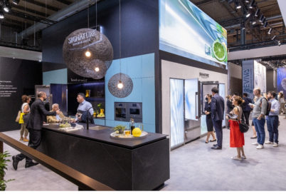 The view of LG SIGNATURE booth at Milan Design Week 2022 with visitors taking a closer look at appliances