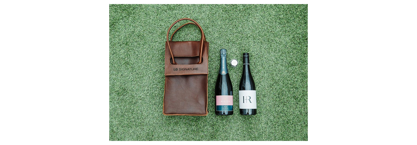 A gift for guests including an LG SIGNATURE leather double wine holder, Wiston Estate Rosé NV, Hoffmann & Rathbone Pinot Noir and an LG SIGNATURE-branded champagne stopper.