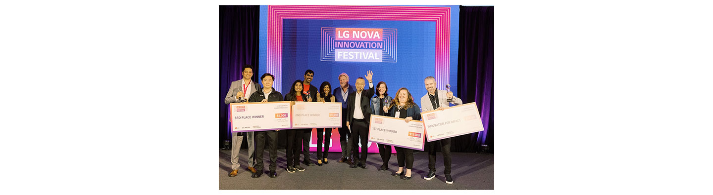 A photo of the winners of the Startup Pitch Competition standing next to each other posing for the camera with their awards