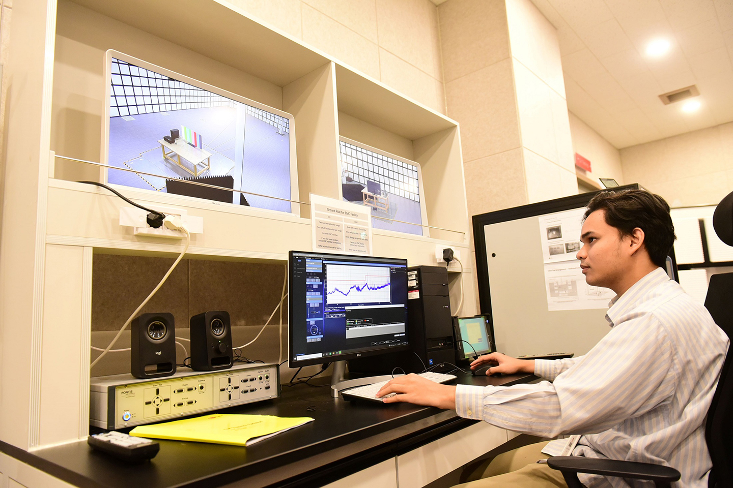 A picture of a man analyzing on the computer