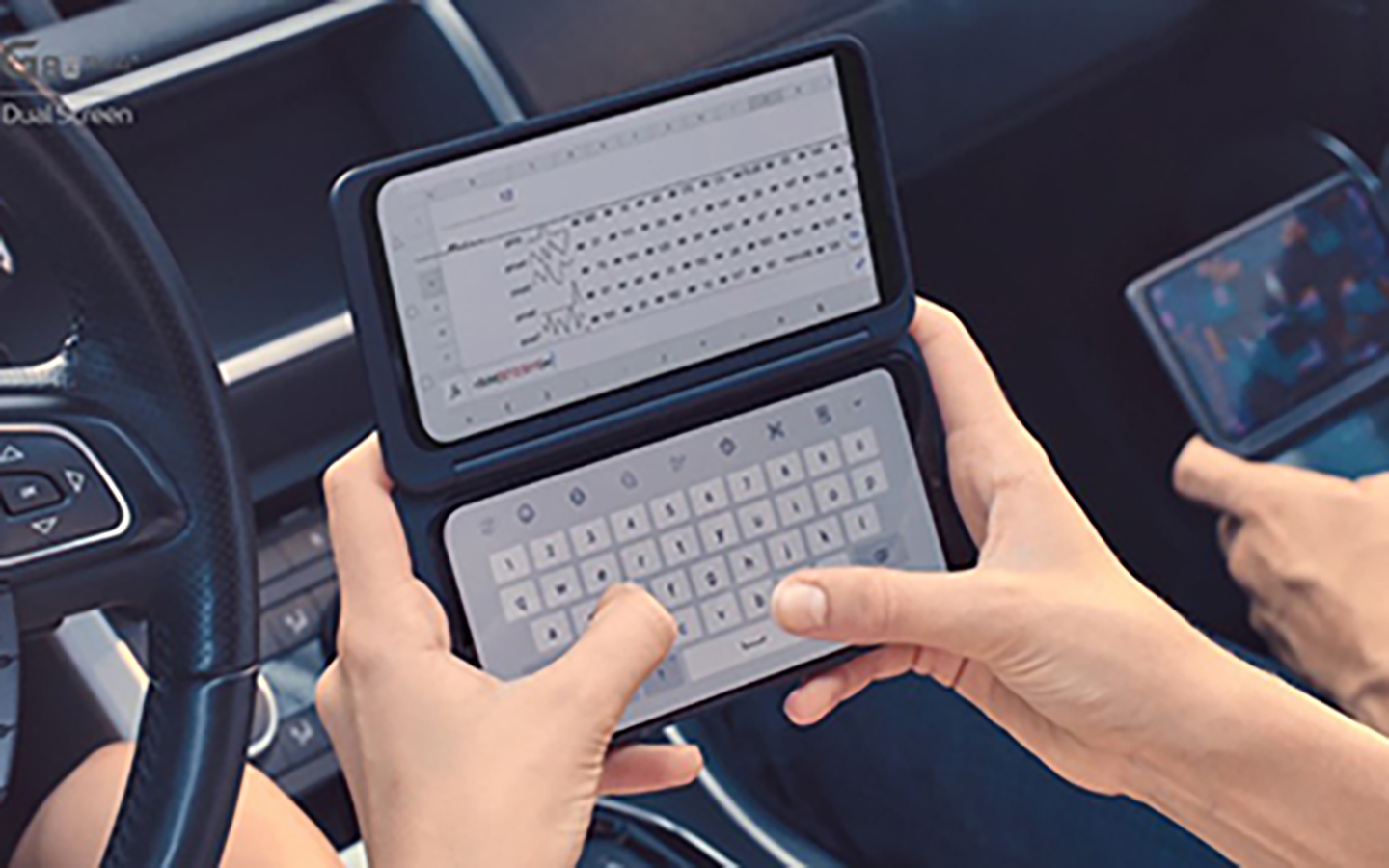 Two people using LG G8X ThinQ with Dual Screen while in a car.