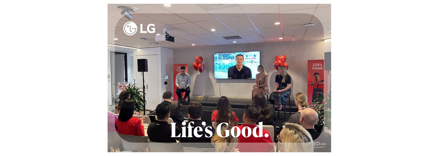 An image of people gathered around talking and listening with a frame around the iamge with the LG logo