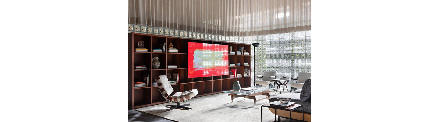 The bedroom of LG Magenta House at CASACOR decorated with LG TV displaying a colorful image