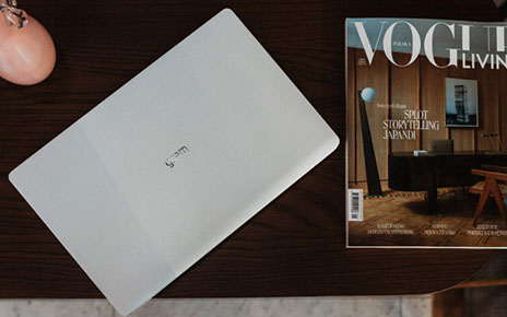 LG gram placed next to the first edition of Vogue Polska magazine