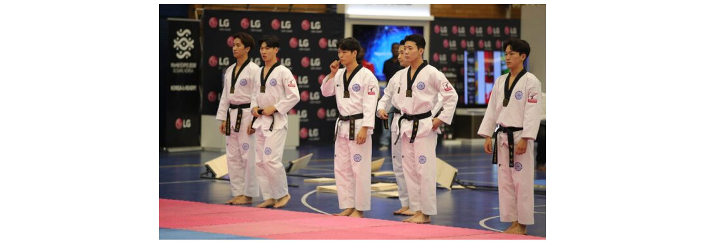 Taekwondo athletes preparing for a performance at the Ambassador's Taekwondo Cup in South Africa