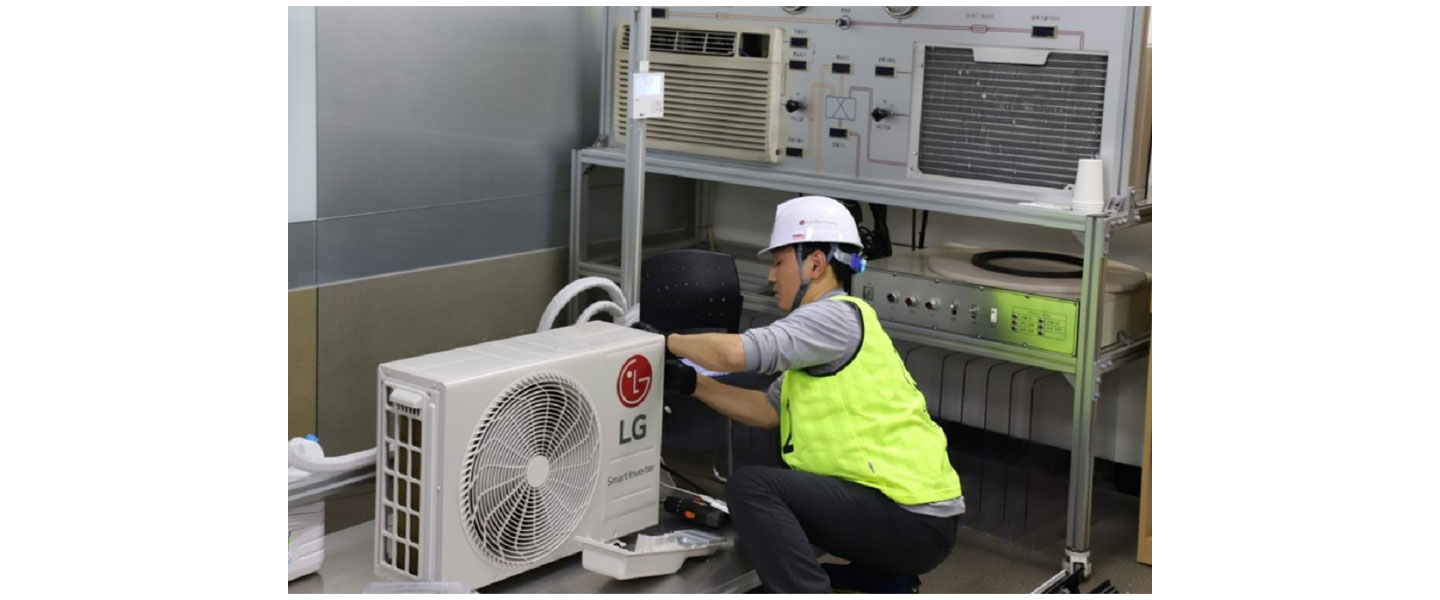 A photo of a LG Service Manager trying to fix a LG product