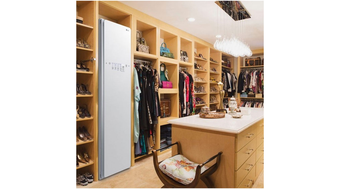 The LG Styler is placed inside a boutique to be displayed alongside lots of fashionable clothing, shoes and accessories