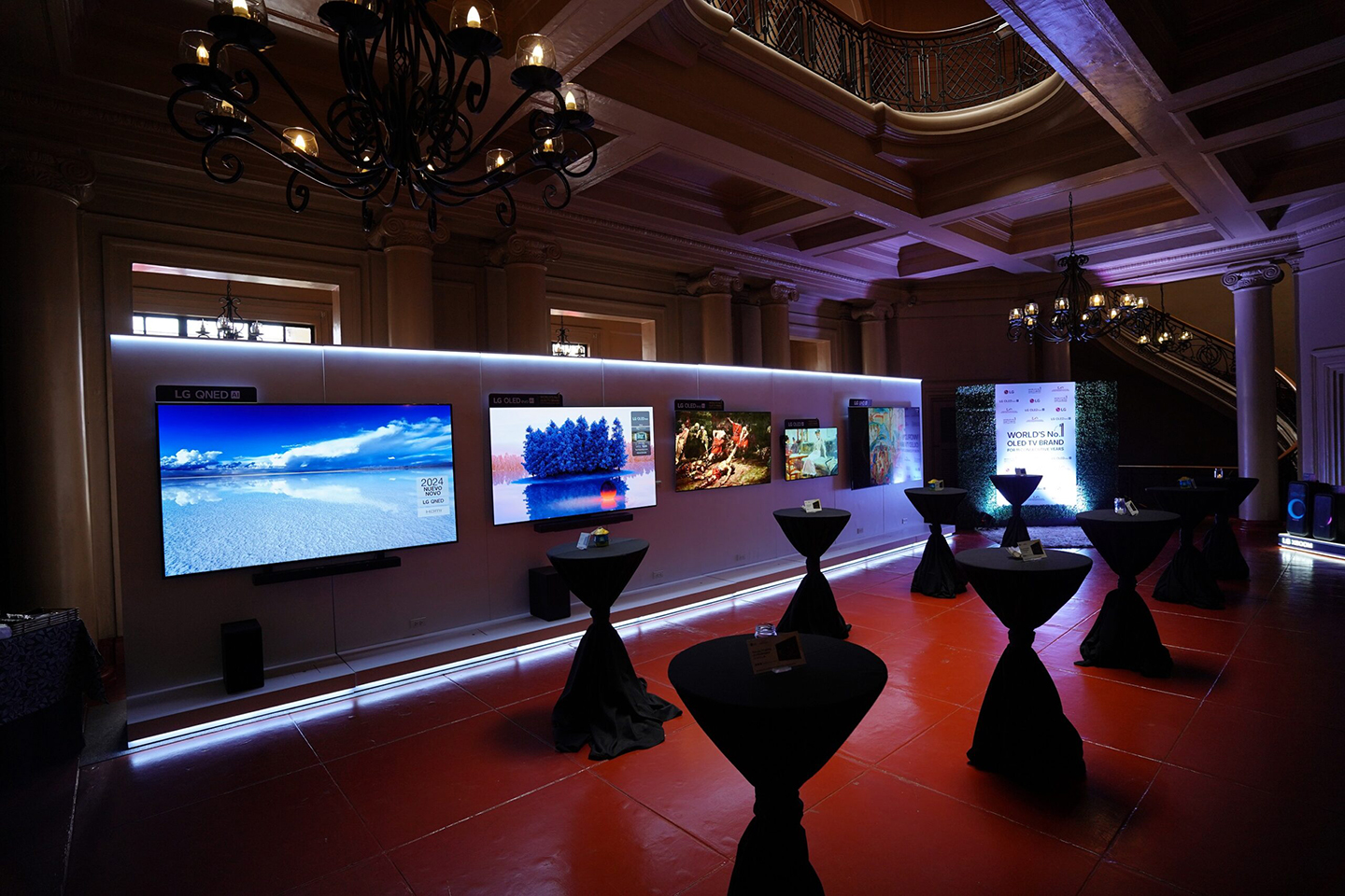 A photo of numerous screens of LG OLED TVs on display in the gallery 
