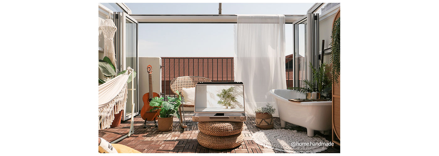 A photo of the LG StanbyME Go placed outdoors in a roof top setting