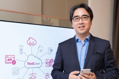 Dr. Kim Dong-wook, head of the DTX Center, posing in front of an LG ThinQ Cloud diagram