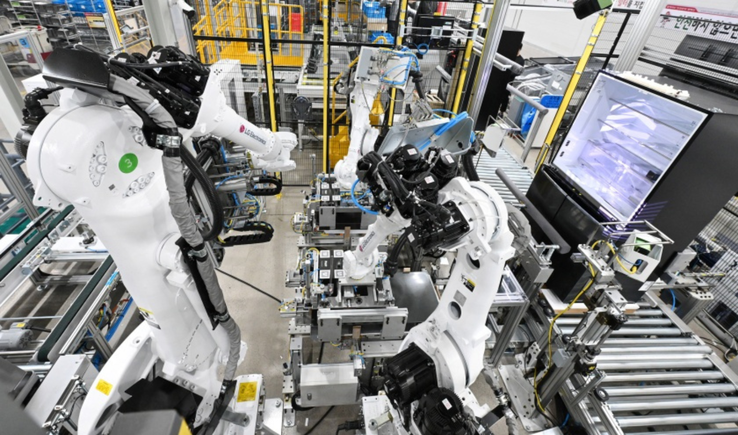 Two robot arms are shown on the floor of the LG Smart Park in Changwon, South Gyeongsang Province.