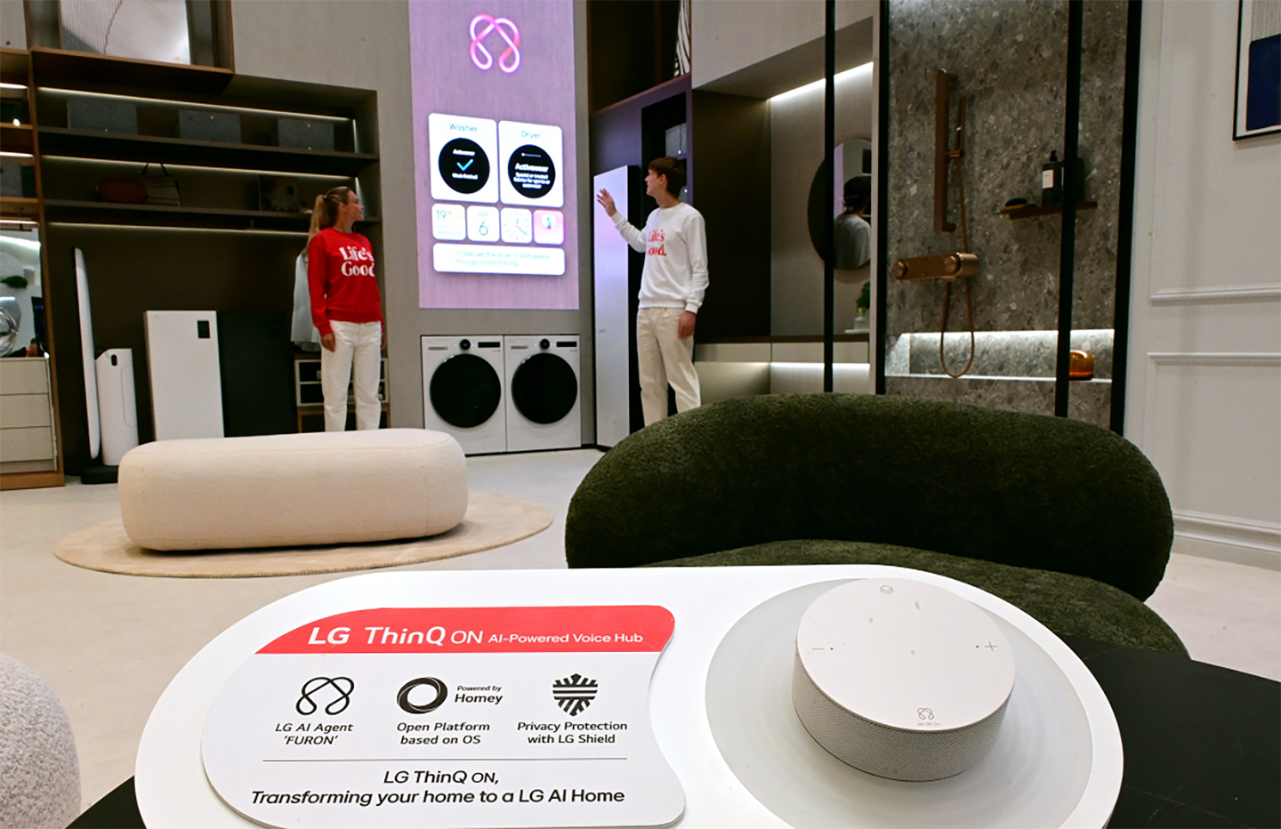 A picure of two people trying out features of LG ThinQ ON