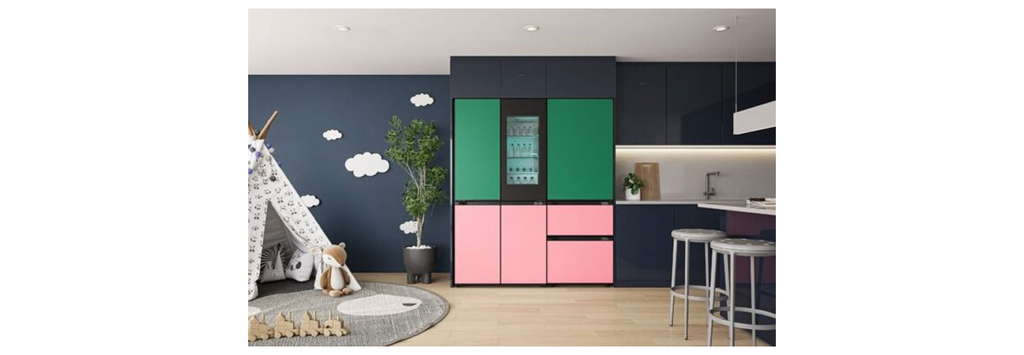 The LG MoodUP refrigerator, with green panels on top and pink panels on the bottom, pictured in a home.